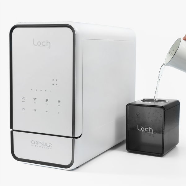 Loch water dispenser with a black cube-shaped device on a white background