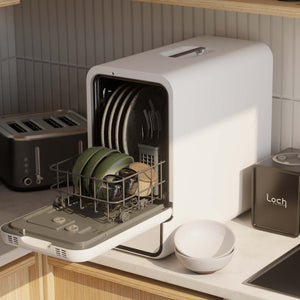Portable dishwasher with dishes inside on a kitchen counter, brand 'Loch' visible