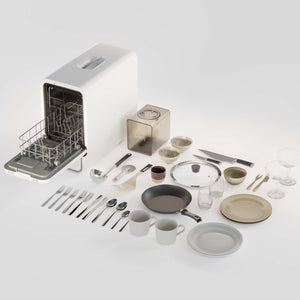 Dishwasher with clean dishes including plates, cups, bowls, and cutlery on a white background